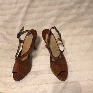 Authentic Christian Louboutin tan leather peel toe heels